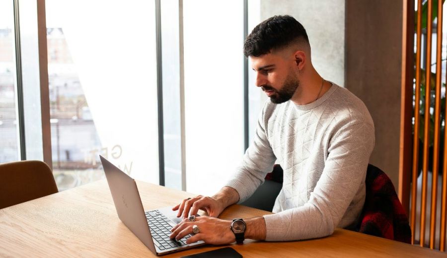Image of a property manager using a laptop device
