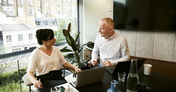 image of two body corporate members in a meeting