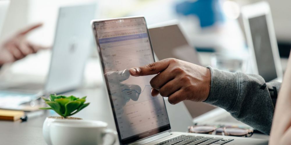 image of a building management team using a laptop device