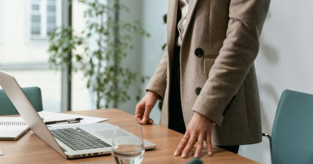 image of a building compliance manager using a laptop device