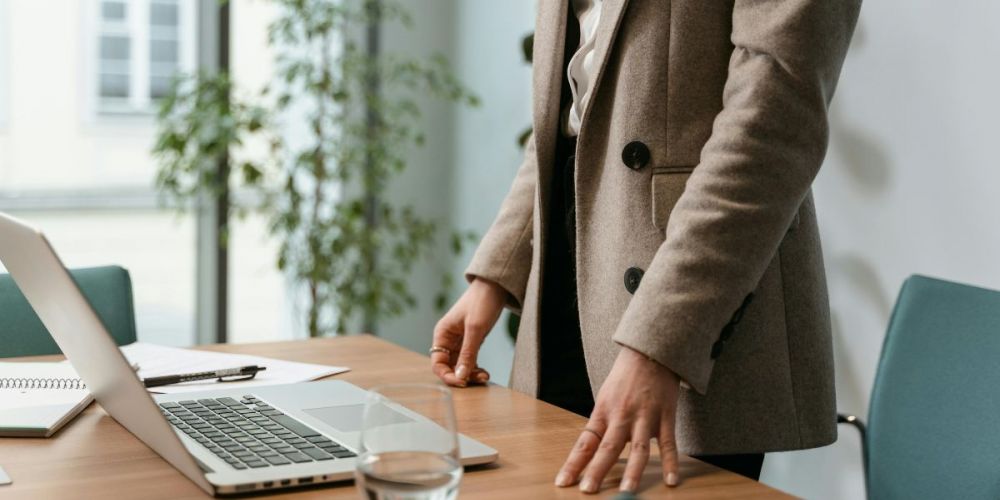 image of a building compliance manager using a laptop device
