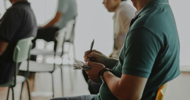 image of a strata committee member in a meeting