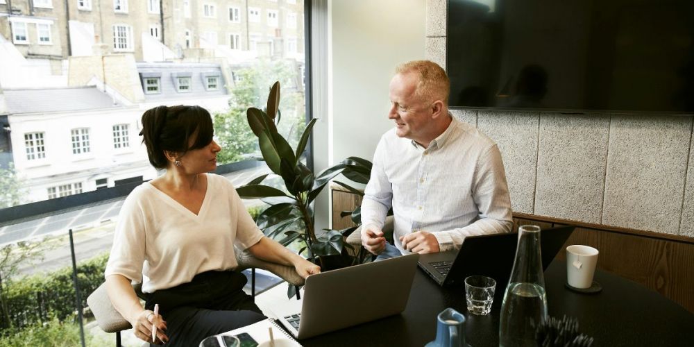 image of two body corporate members in a meeting