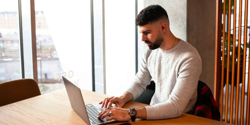 Image of a property manager using a laptop device
