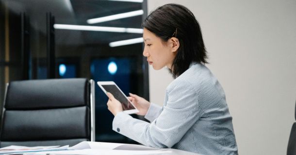 image of a property manager using a tablet device