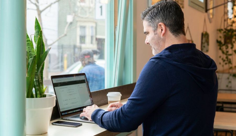 image of a property manager using a laptop device