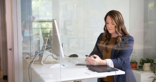 image of a strata manager using a mobile device