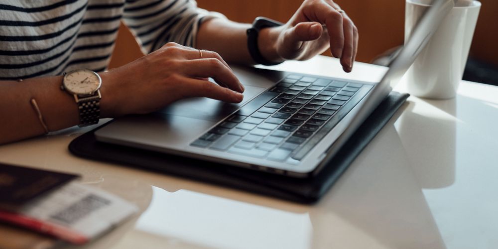 Hands at laptop